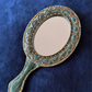 Hand Mirror and Necklace